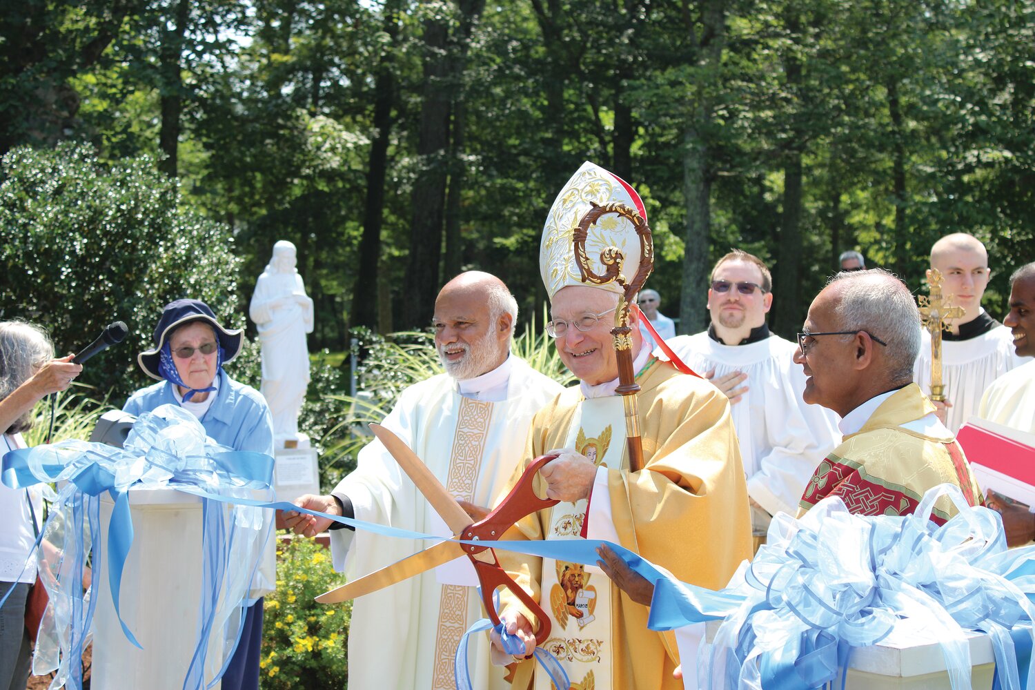 Bishop Robert C. Evans celebrated a Mass commemorating the 100th anniversary of the Shrine of the Little Flower.  Bishop Evans also led a ribbon-cutting ceremony for the beautiful new Rosary Walk constructed on Shrine grounds, pictured above.